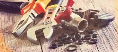 A handful of plumbing tools to fix a loud sump pump in the Vancouver area